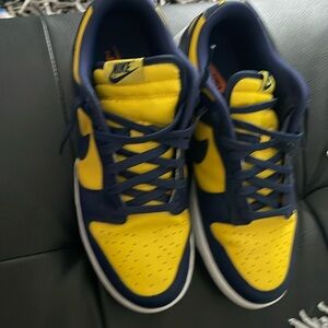Blue and yellow Nike Dunk with blue shoe strings